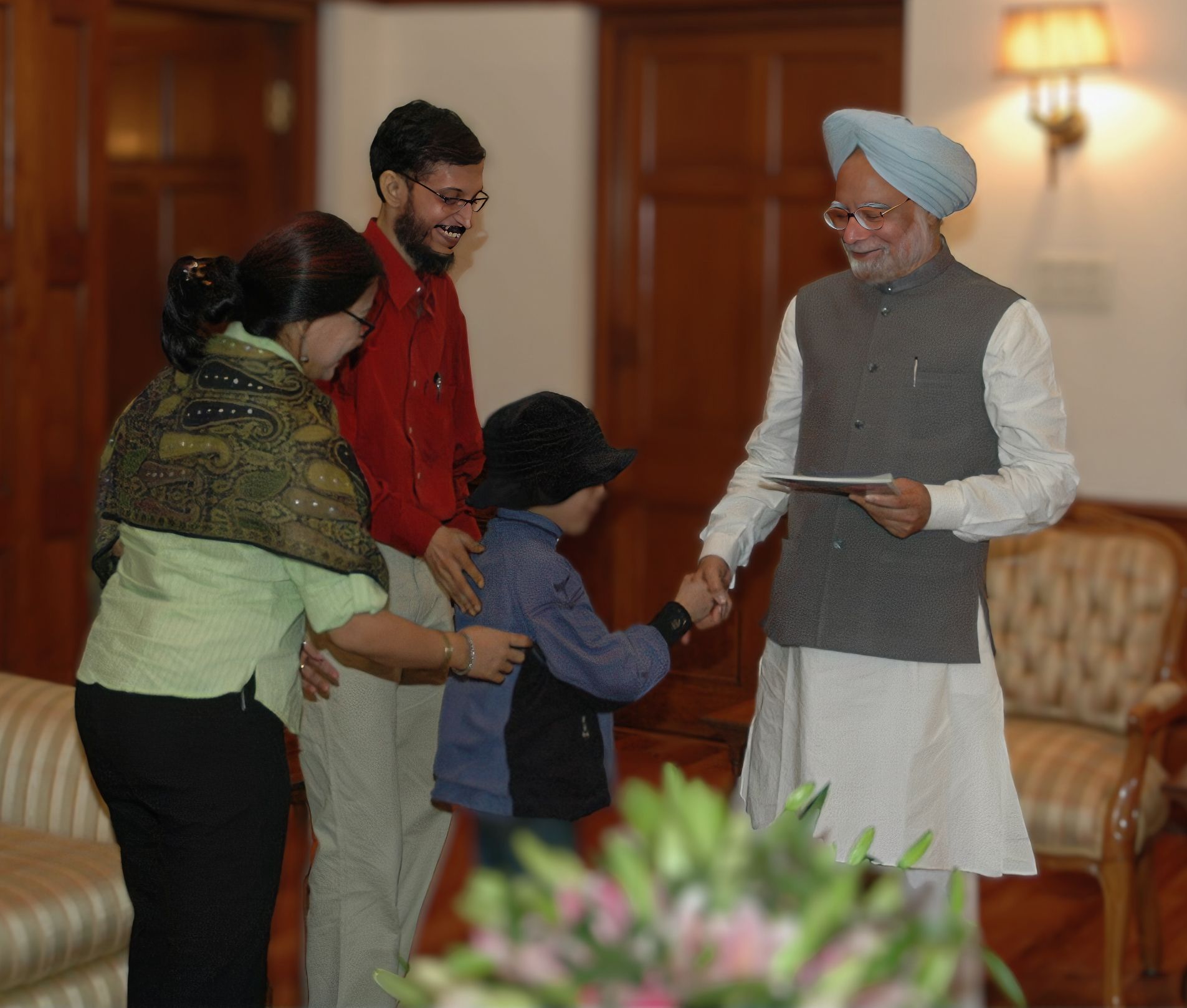 Abhigyan Guha with Dr. Manmohan Singh Prime Minister of India.
